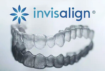Invisalign clear aligners displayed showing upper and lower dental trays with logo.