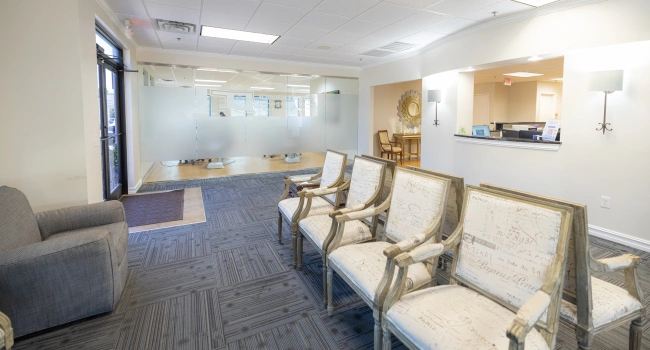 Modern orthodontic office waiting room with comfortable seating and contemporary décor.